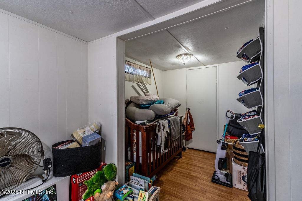 19040 Waterville Road Jacksonville, FL 32226 - Photo 17 of 28 a room with toys and wooden floor
