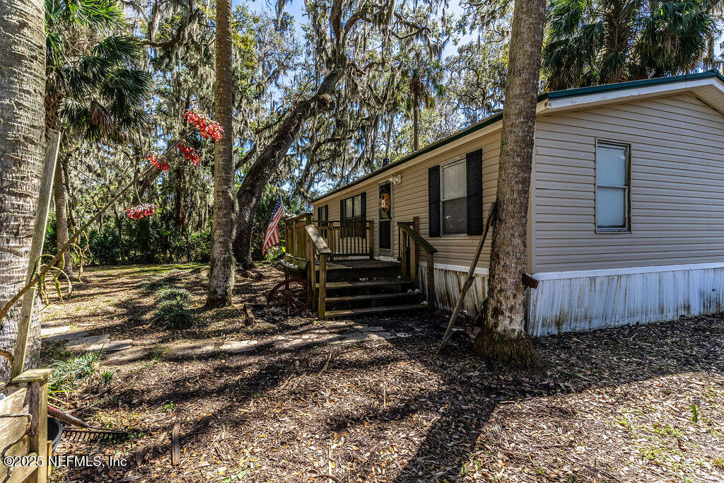 19040 Waterville Road Jacksonville, FL 32226 - Photo 5 of 28 a view of a house with a yard