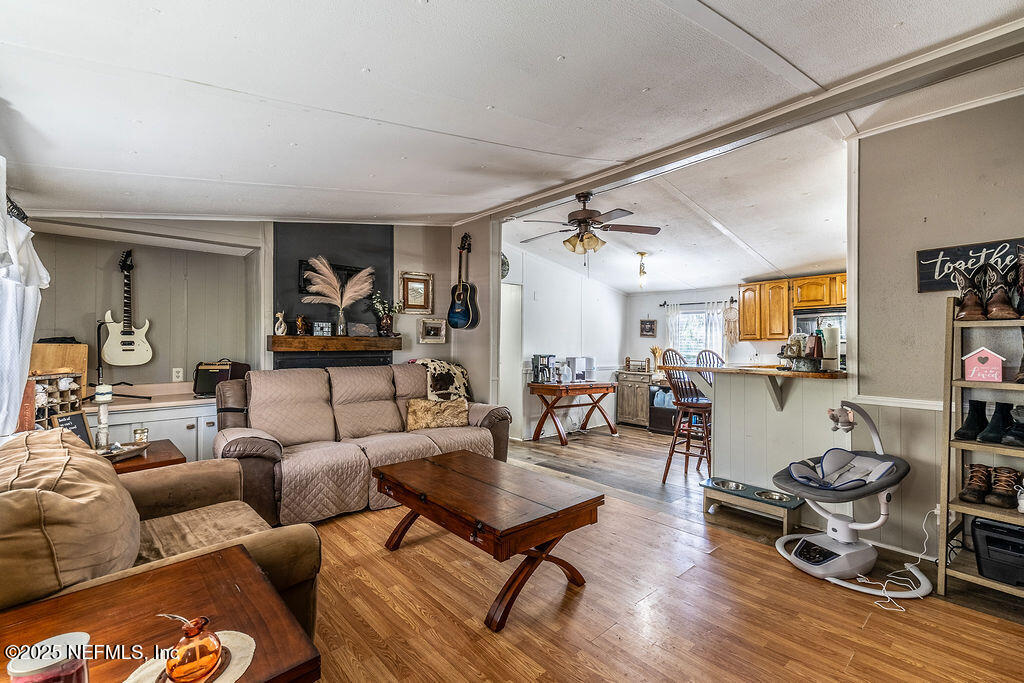 19040 Waterville Road Jacksonville, FL 32226 - Photo 7 of 28 a living room with furniture and wooden floor