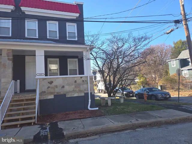 a view of a building with a yard
