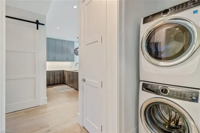 a view of a hallway with washer and dryer