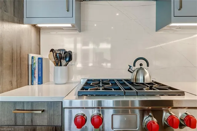 a close view of sink a faucet and a stove