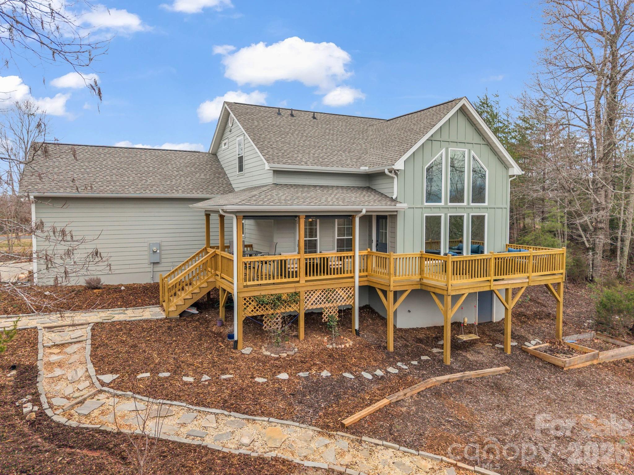 631 Mountain Parkway Mill Spring, NC 28756 - Photo 1 of 43 a view of a house with a patio