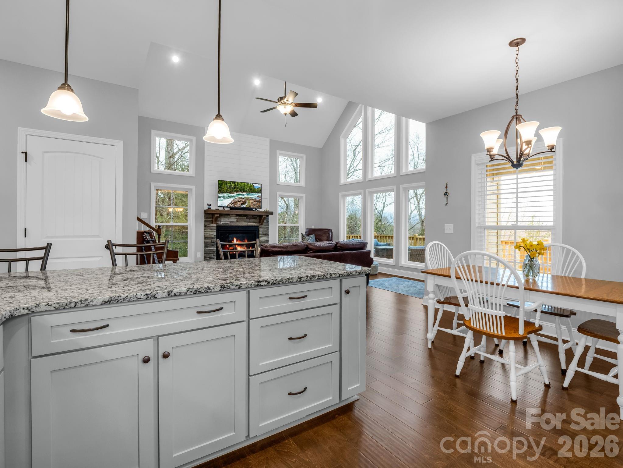 631 Mountain Parkway Mill Spring, NC 28756 - Photo 13 of 43 a large kitchen with a large counter space a sink appliances and living room view