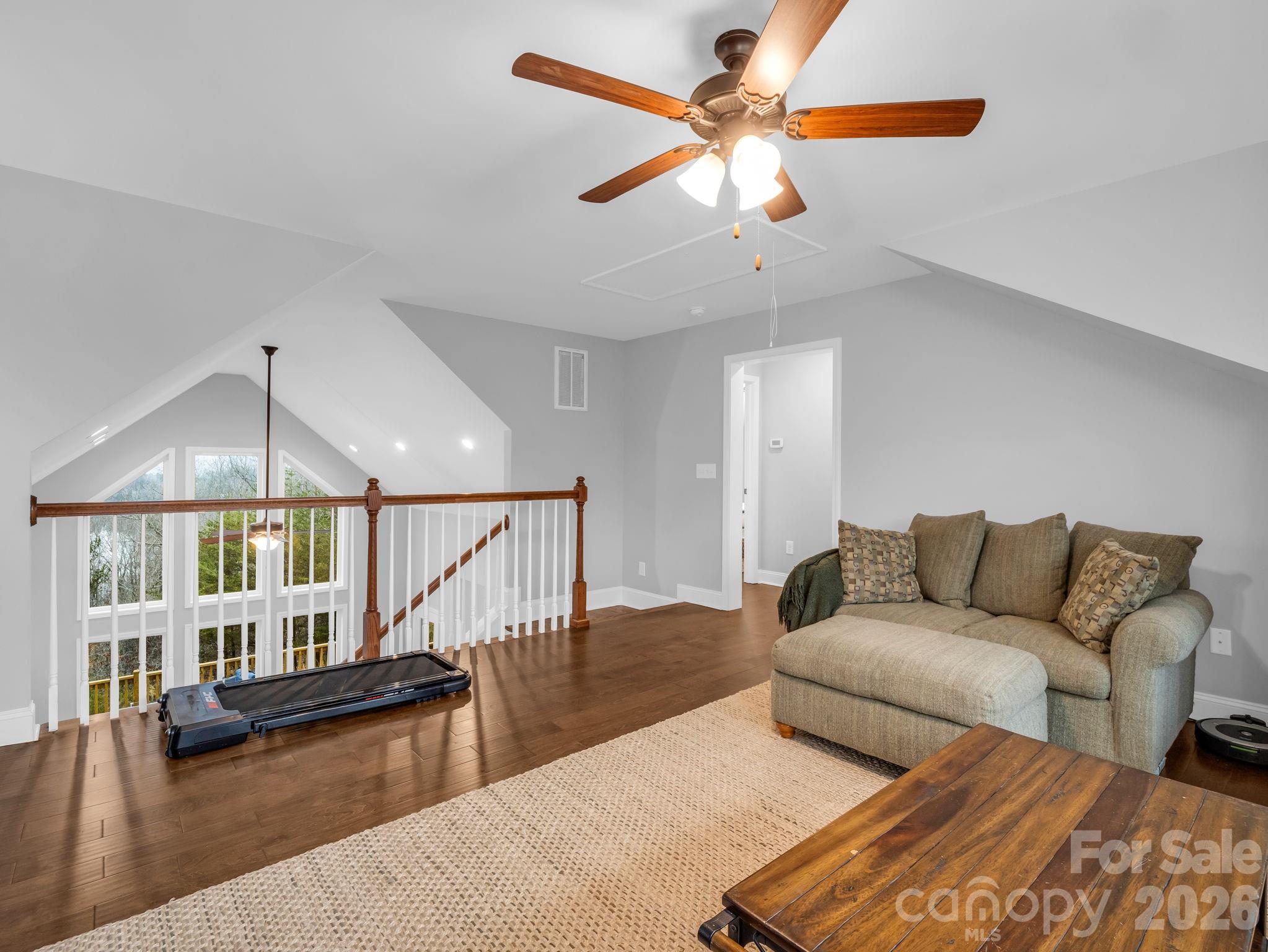 631 Mountain Parkway Mill Spring, NC 28756 - Photo 21 of 43 a living room with furniture and a wooden floor