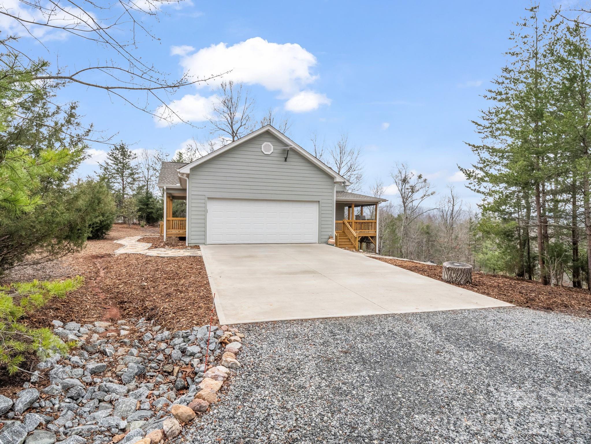 631 Mountain Parkway Mill Spring, NC 28756 - Photo 6 of 43 a house with a yard