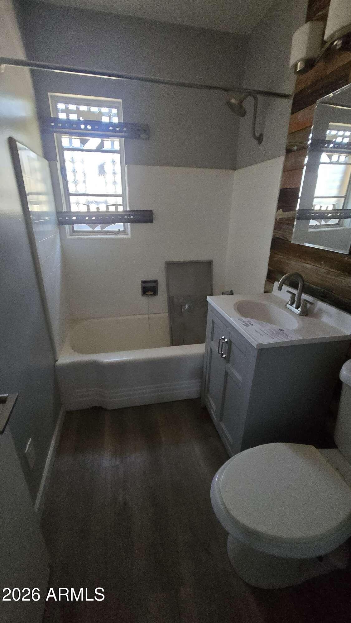 834 West Osborn Road Phoenix, AZ 85013 - Photo 20 of 45 a bathroom with a sink toilet and window