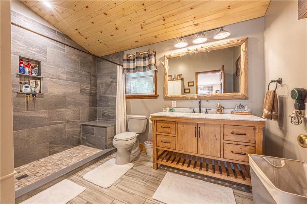 130 Alpine Smock, PA 15480 - Photo 20 of 41 a bathroom with a double vanity sink a toilet a mirror and shower