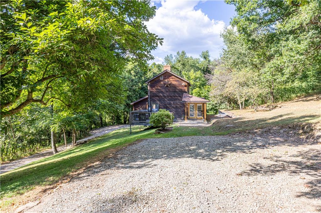 130 Alpine Smock, PA 15480 - Photo 2 of 41 a front view of a house with a yard