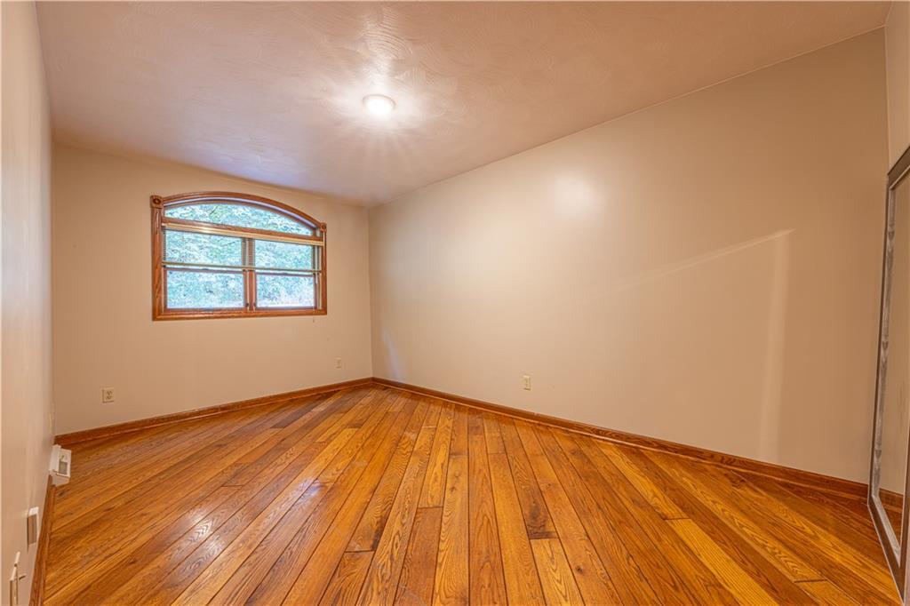 130 Alpine Smock, PA 15480 - Photo 21 of 41 an empty room with wooden floor and windows