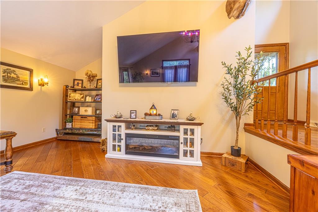 130 Alpine Smock, PA 15480 - Photo 27 of 41 a living room with a fireplace furniture and a potted plant
