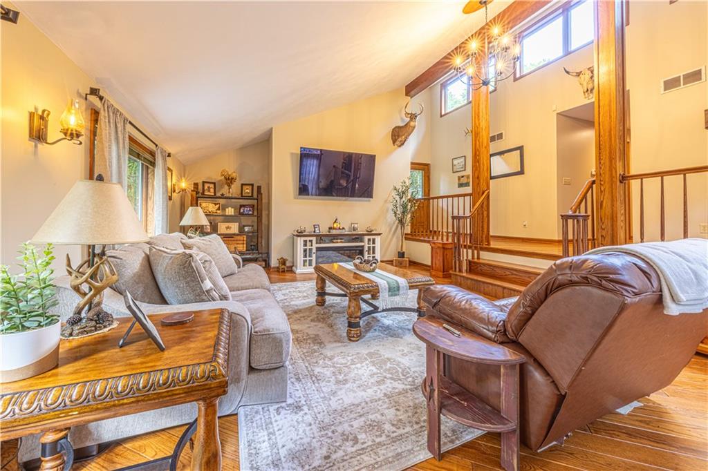 130 Alpine Smock, PA 15480 - Photo 29 of 41 a living room with furniture a rug and a floor to ceiling window