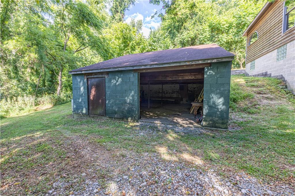 130 Alpine Smock, PA 15480 - Photo 9 of 41 a front view of a house with garden