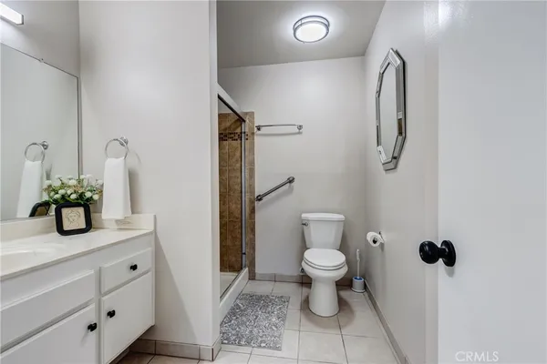 a bathroom with a toilet sink and shower