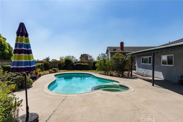 a view of swimming pool with a yard
