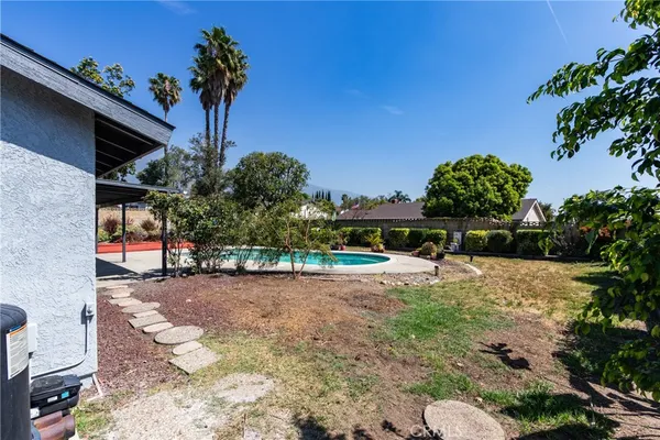 a view of a backyard of a house