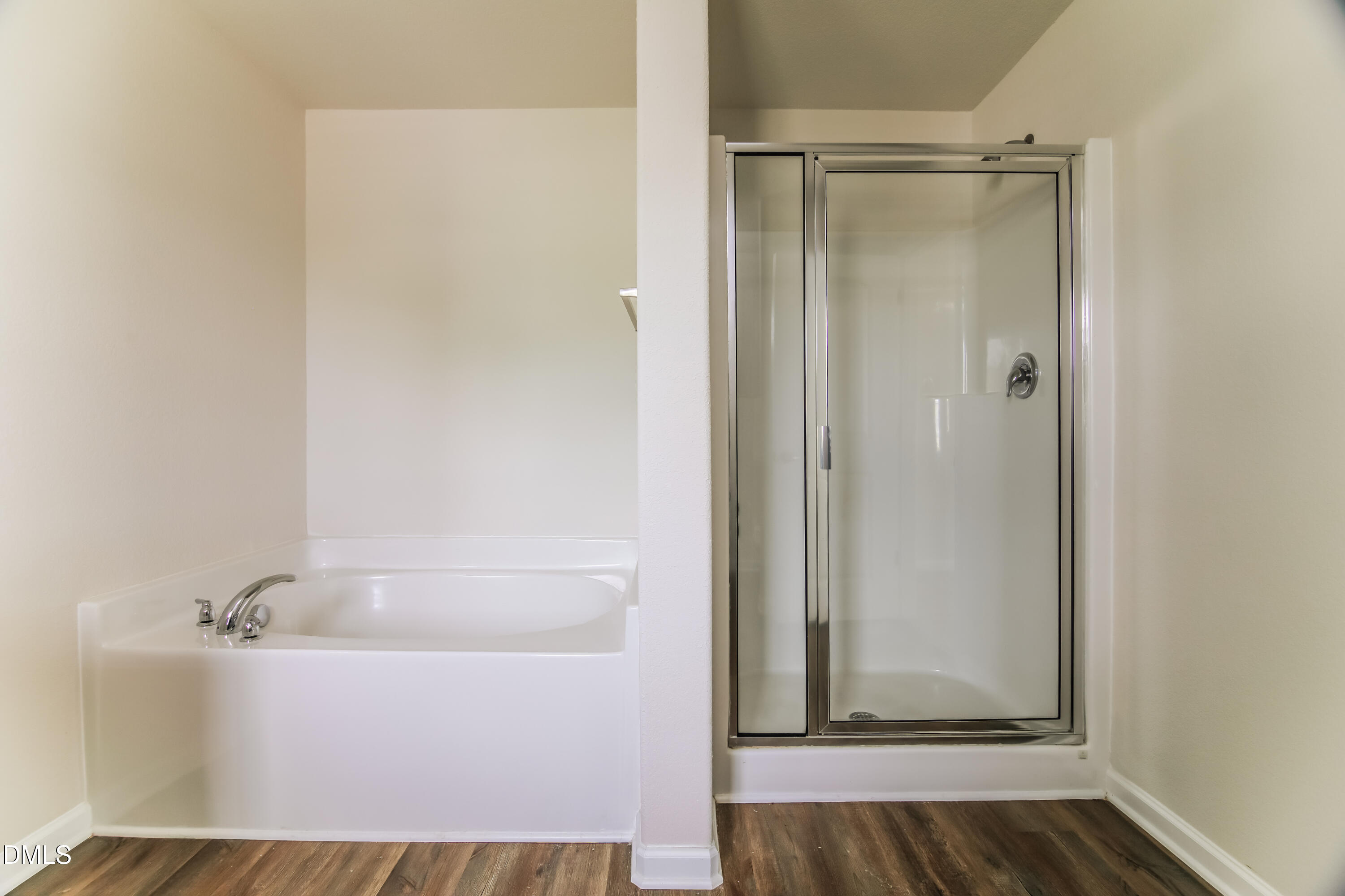336 Gourd Street Zebulon, NC 27597 - Photo 11 of 17 a bathroom with a bathtub and shower
