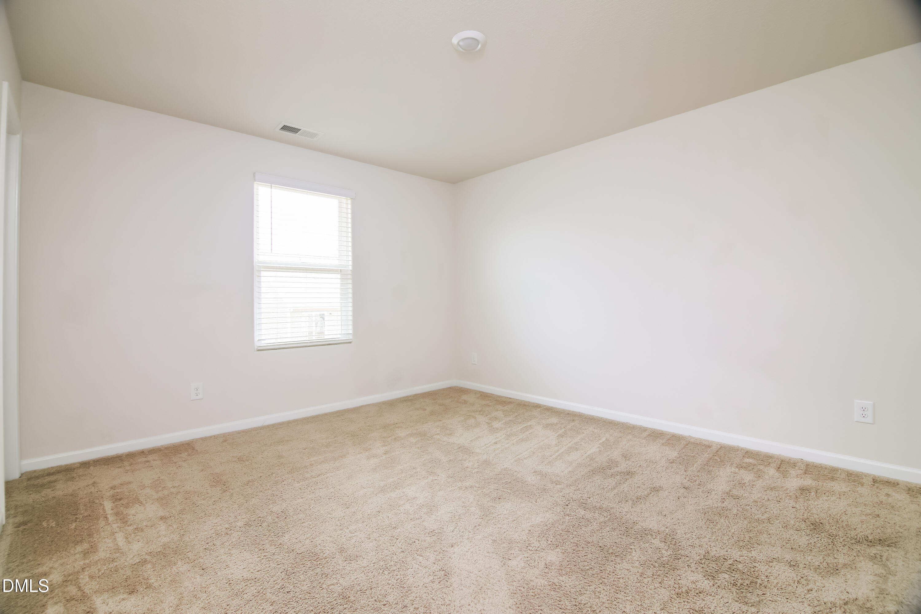 336 Gourd Street Zebulon, NC 27597 - Photo 12 of 17 an empty room with a window