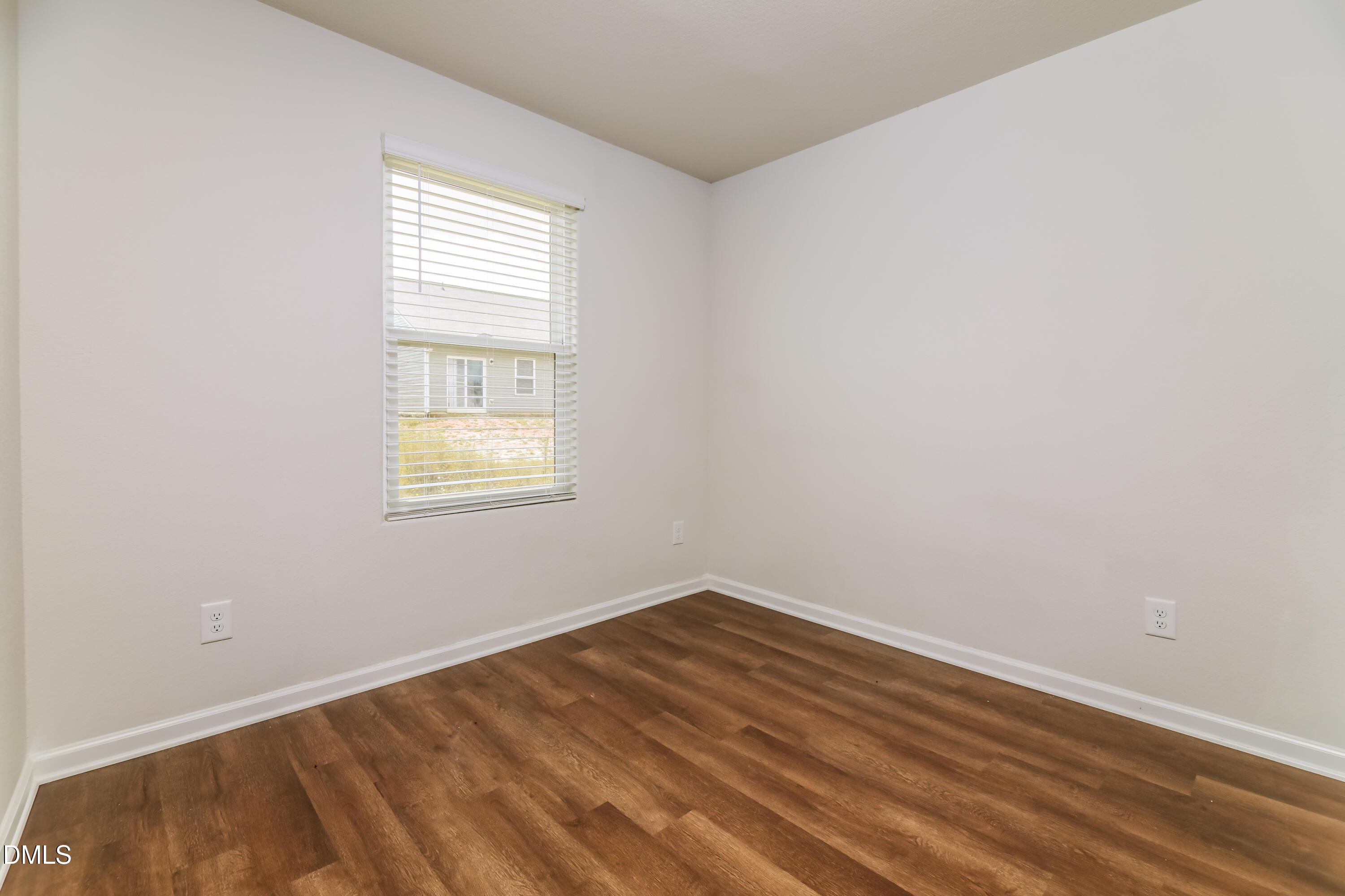 336 Gourd Street Zebulon, NC 27597 - Photo 13 of 17 an empty room with a window