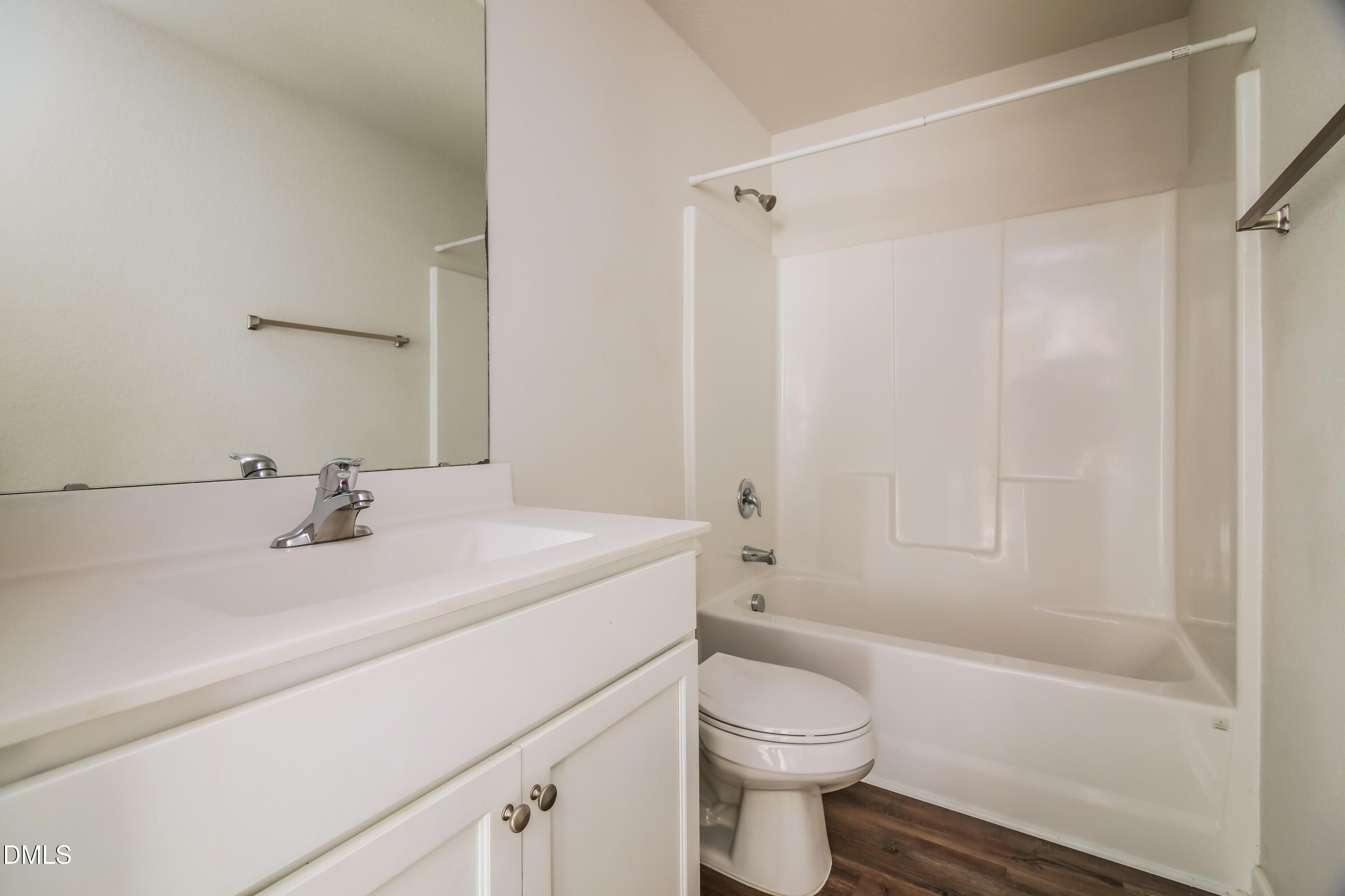 336 Gourd Street Zebulon, NC 27597 - Photo 14 of 17 a bathroom with a sink a toilet and shower