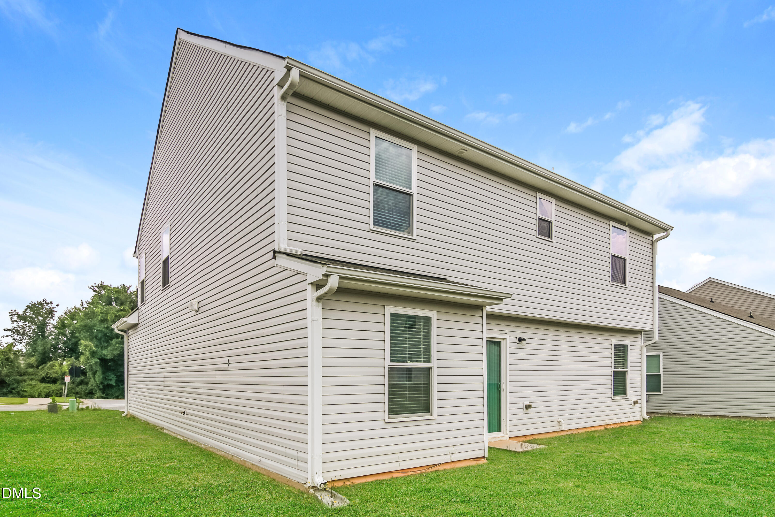 336 Gourd Street Zebulon, NC 27597 - Photo 15 of 17 a view of a house with a yard