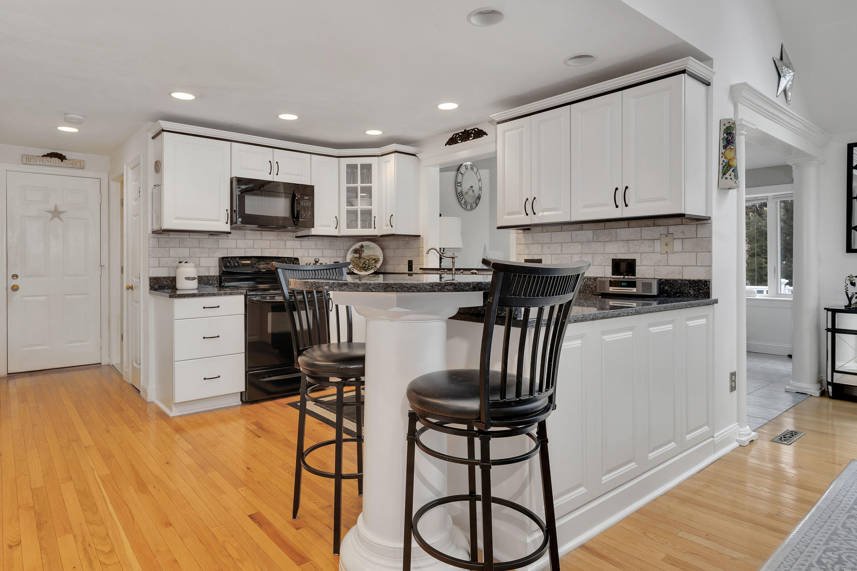 48 Square Rigger Lane Hyannis, MA 02601 - Photo 12 of 36 a kitchen with stainless steel appliances granite countertop a stove top oven a sink a refrigerator and white cabinets