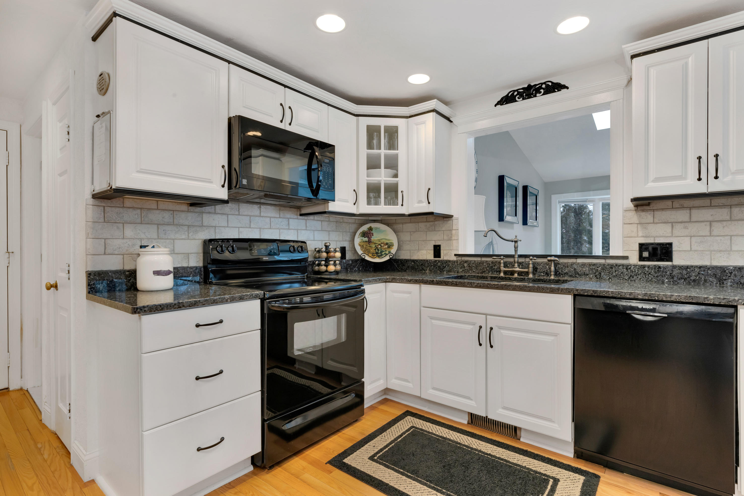 48 Square Rigger Lane Hyannis, MA 02601 - Photo 13 of 36 a kitchen with stainless steel appliances granite countertop a sink and cabinets