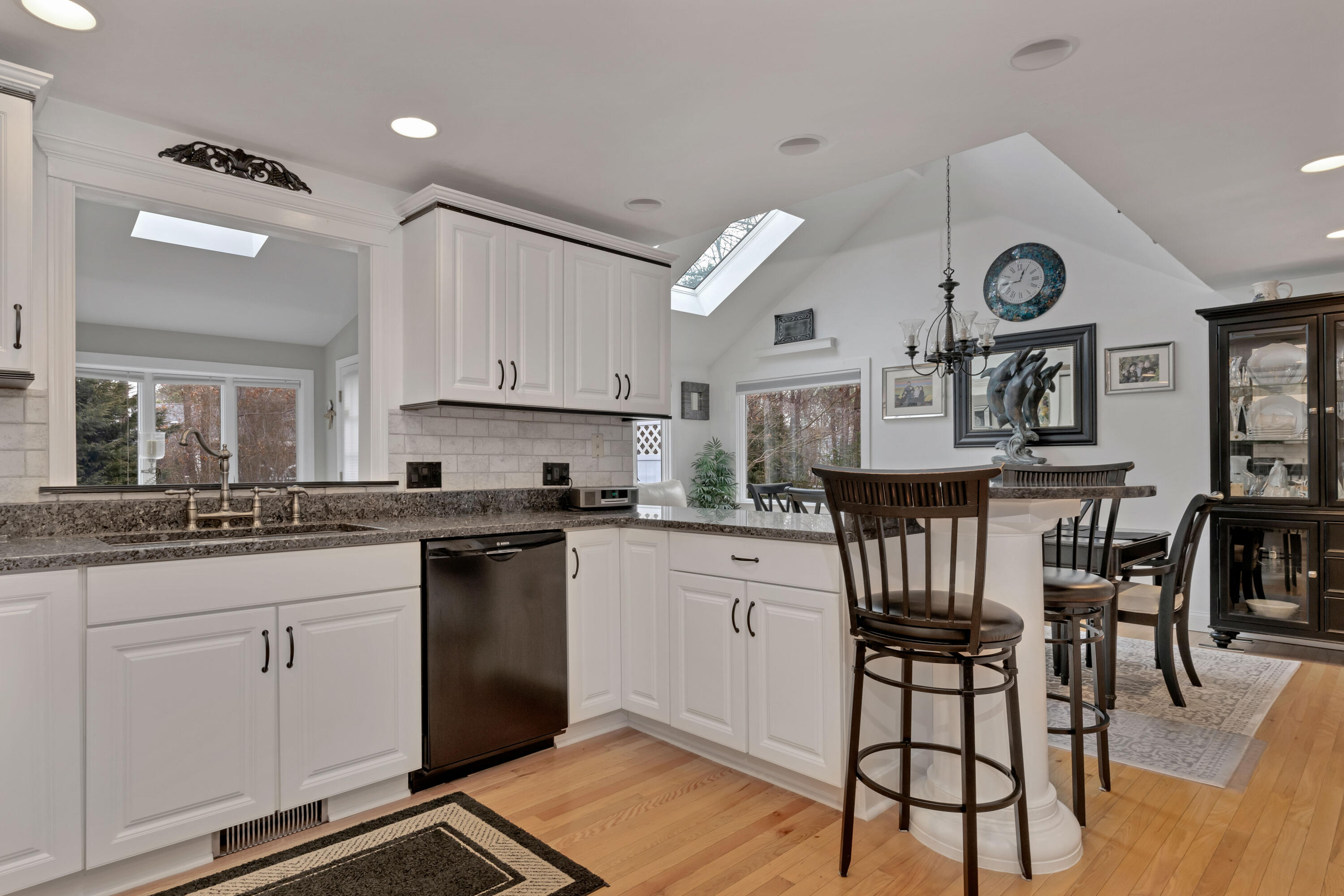 48 Square Rigger Lane Hyannis, MA 02601 - Photo 14 of 36 a kitchen with cabinets and chairs in it