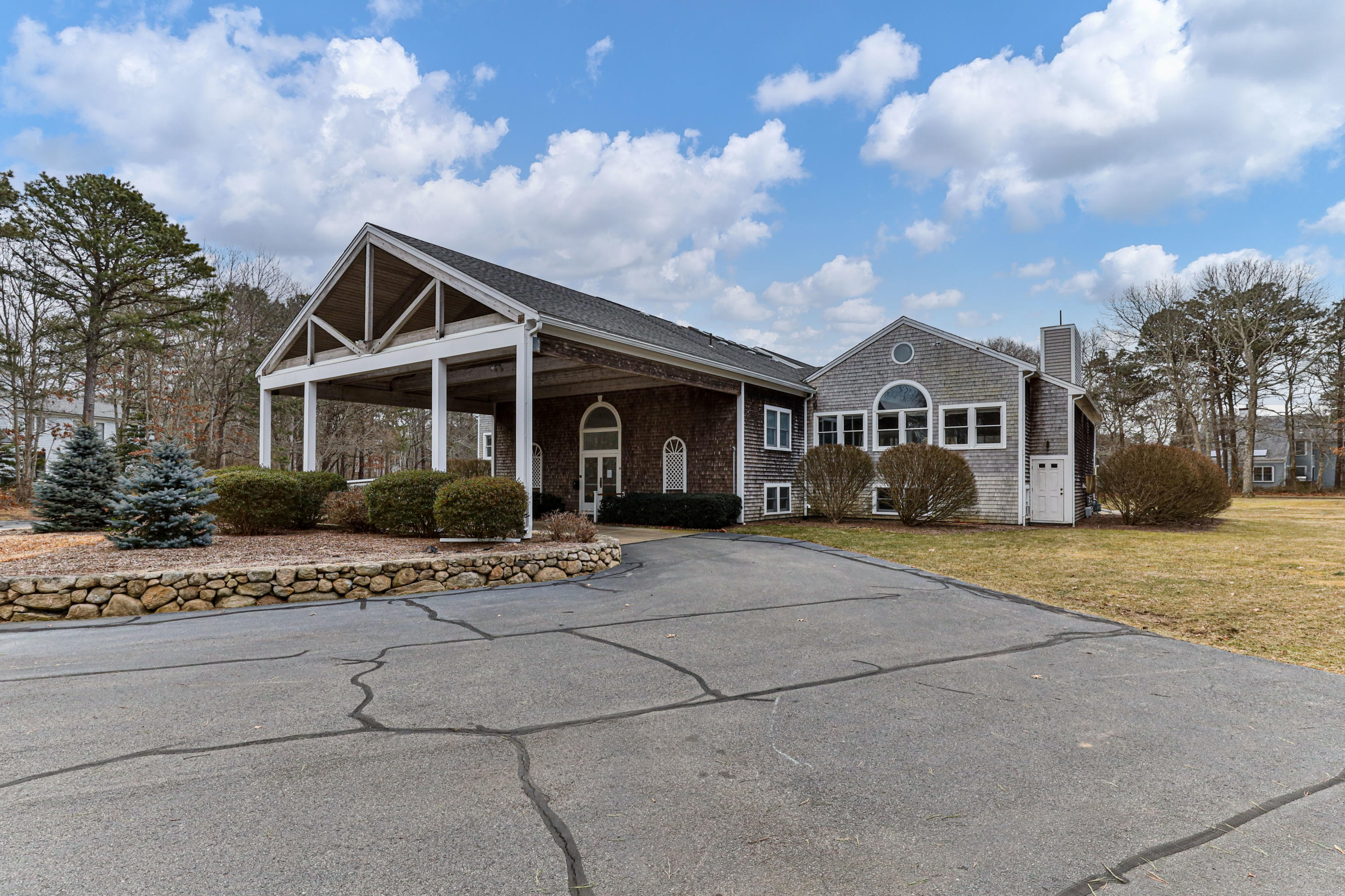 48 Square Rigger Lane Hyannis, MA 02601 - Photo 32 of 36 a front view of a house with a garden