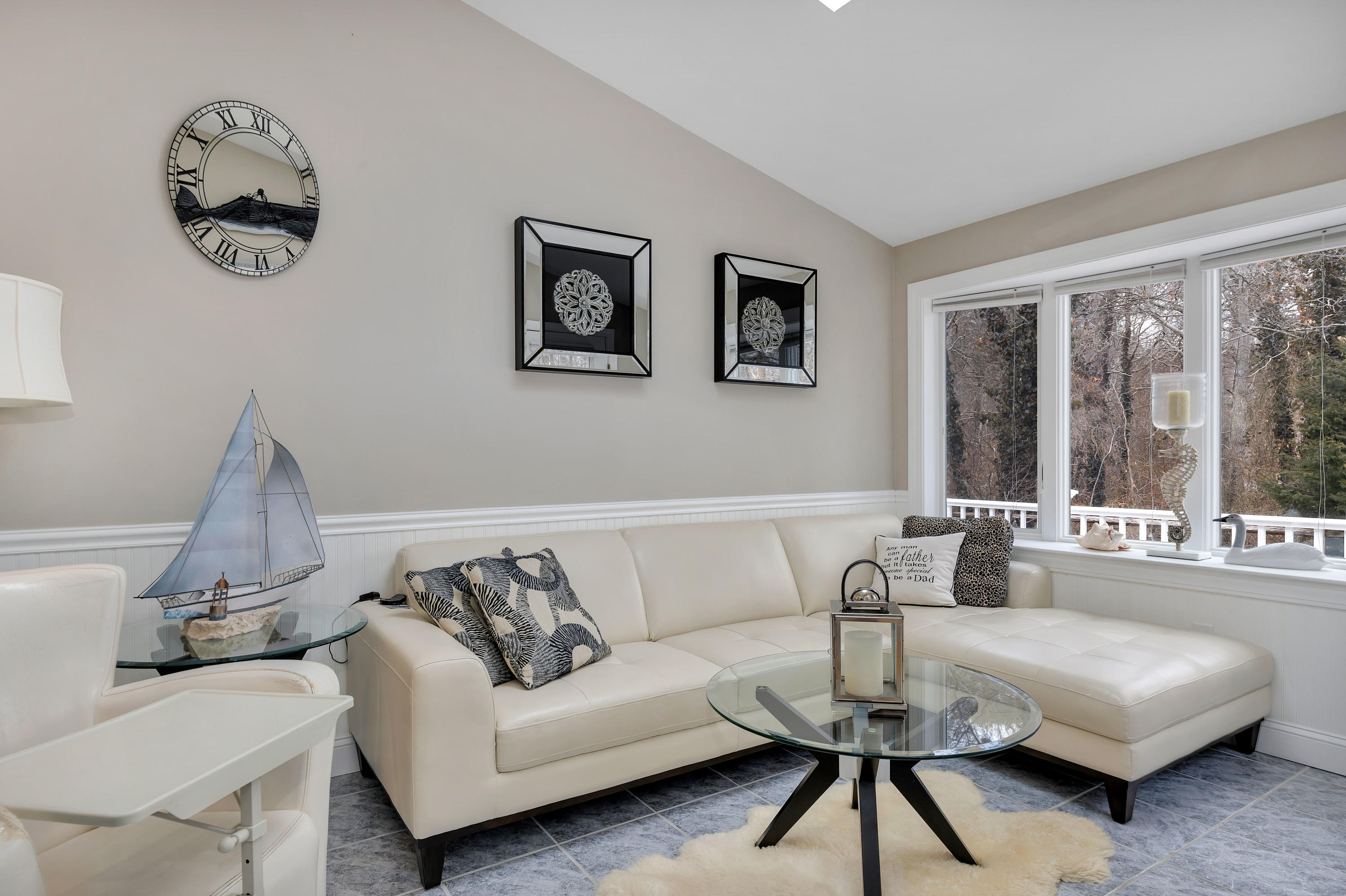 48 Square Rigger Lane Hyannis, MA 02601 - Photo 8 of 36 a living room with a couch and a large window