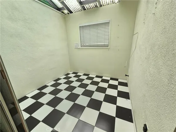 a black and white checkered floor with a black white checkered floor
