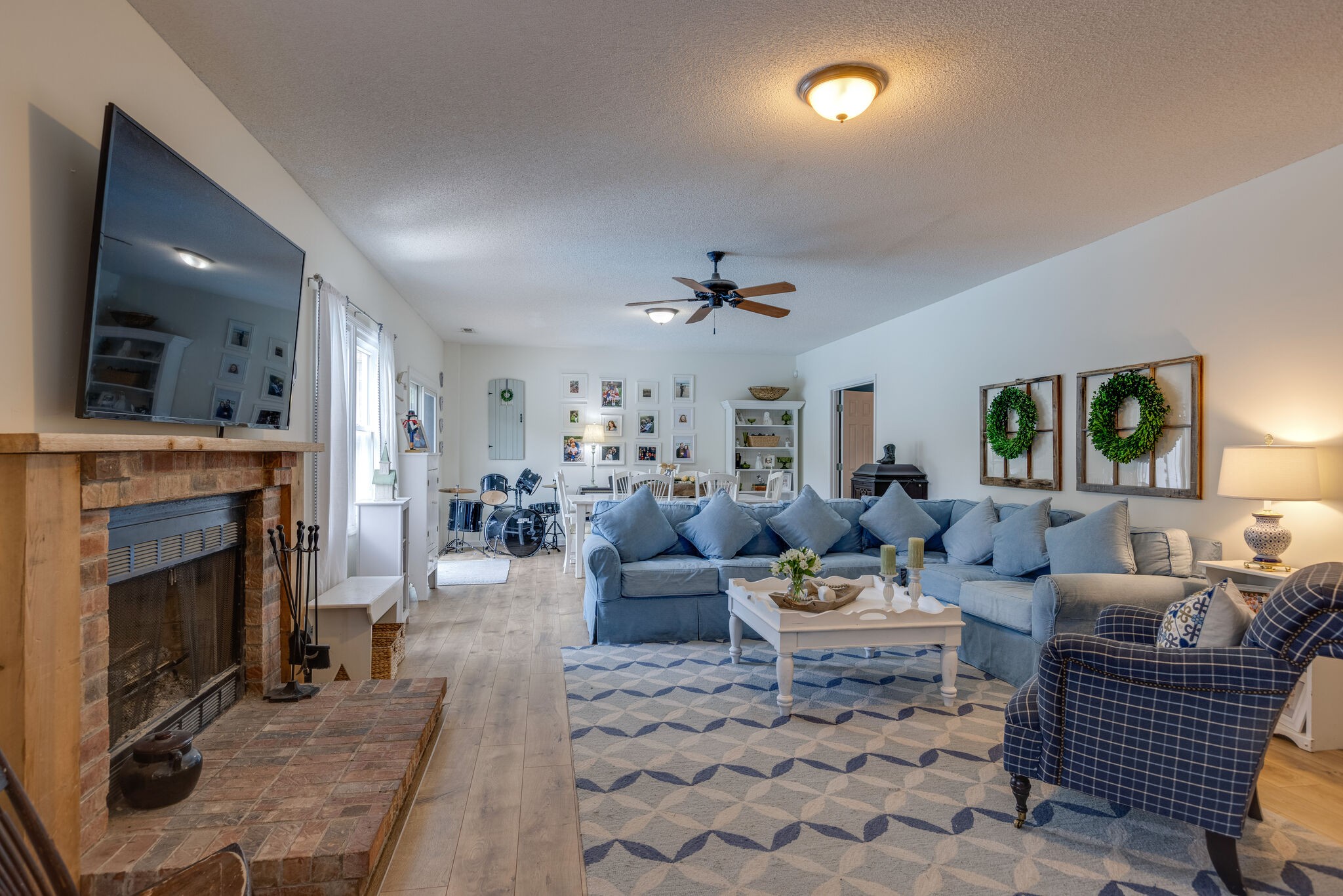 763 High Point Ridge Road Franklin, TN 37069 - Photo 22 of 46 a living room with furniture a fireplace and a flat screen tv