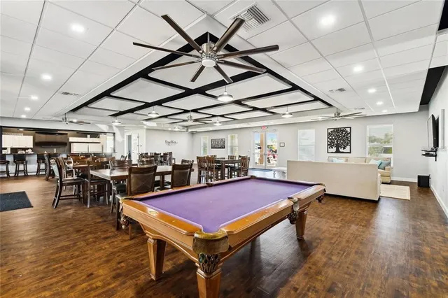 a room with furniture and pool table