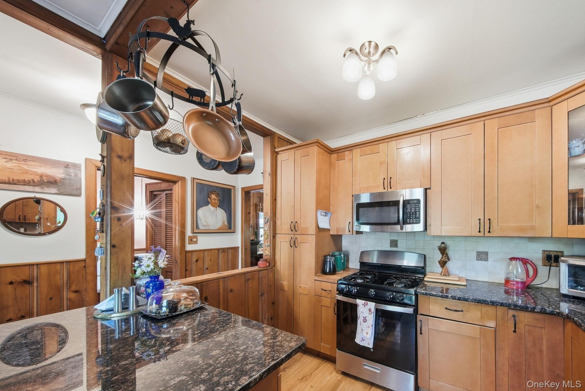 370 Starlight Road Monticello, NY 12701 - Photo 20 of 49 a kitchen with stainless steel appliances kitchen island granite countertop a stove and cabinets