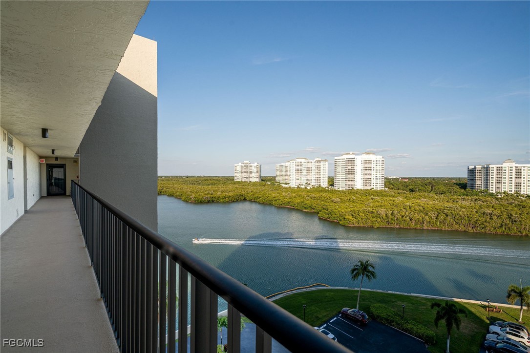 17 Bluebill Avenue, Unit 903 Naples, FL 34108 - Photo 26 of 33 a view of a balcony next to a lake view