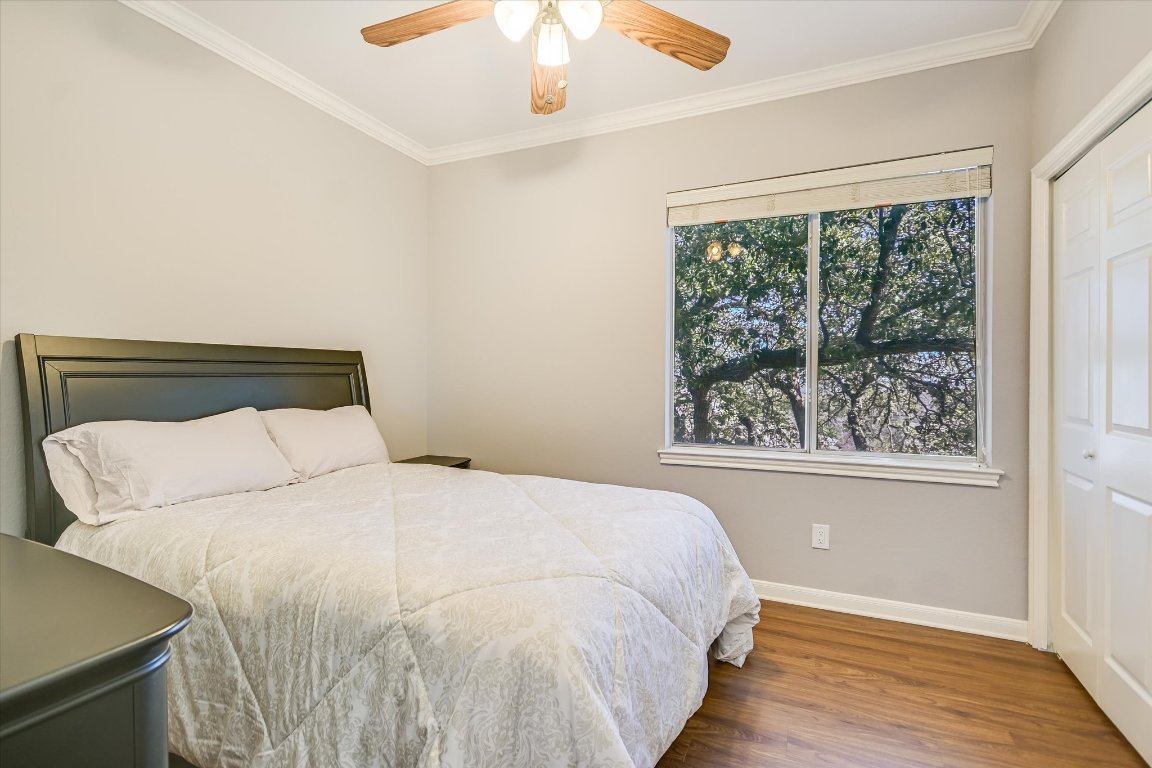 7501 Shadowridge Run, Unit 110 Austin, TX 78749 - Photo 12 of 20 The third bedroom stays cool and shady under the canopy of the trees.