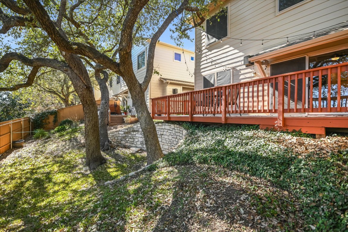 7501 Shadowridge Run, Unit 110 Austin, TX 78749 - Photo 16 of 20 The back yard shaded by mature trees is the perfect space to take Fido for their morning walk.