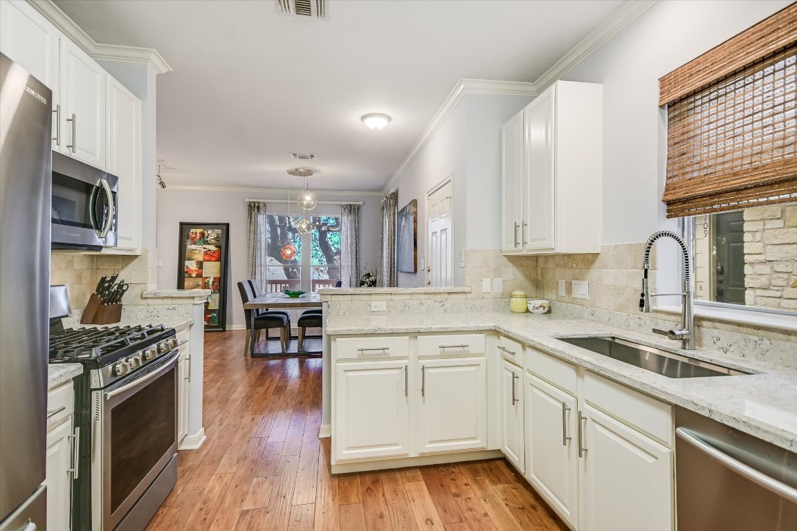 7501 Shadowridge Run, Unit 110 Austin, TX 78749 - Photo 6 of 20 With a gas range, included refrigerator and plenty of storage, your inner chef will have plenty of space to play!