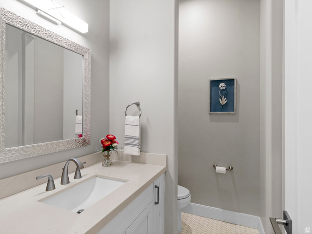 614 East High Lane Alpine, UT 84004 - Photo 50 of 75 Half bath with vanity and toilet