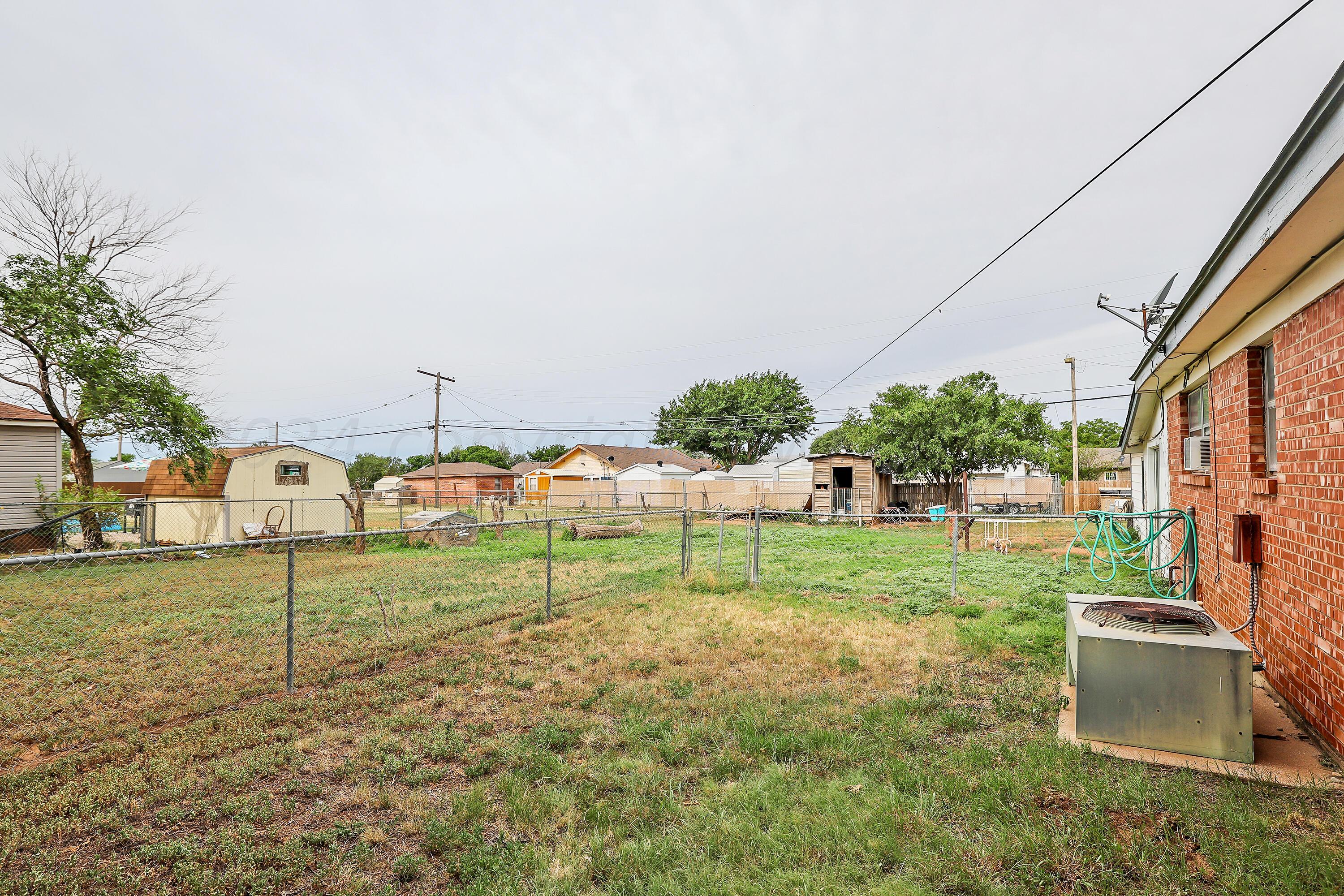 411 North Prospect Street Amarillo, TX 79106 - Photo 20 of 22 a view of a house with backyard and trees