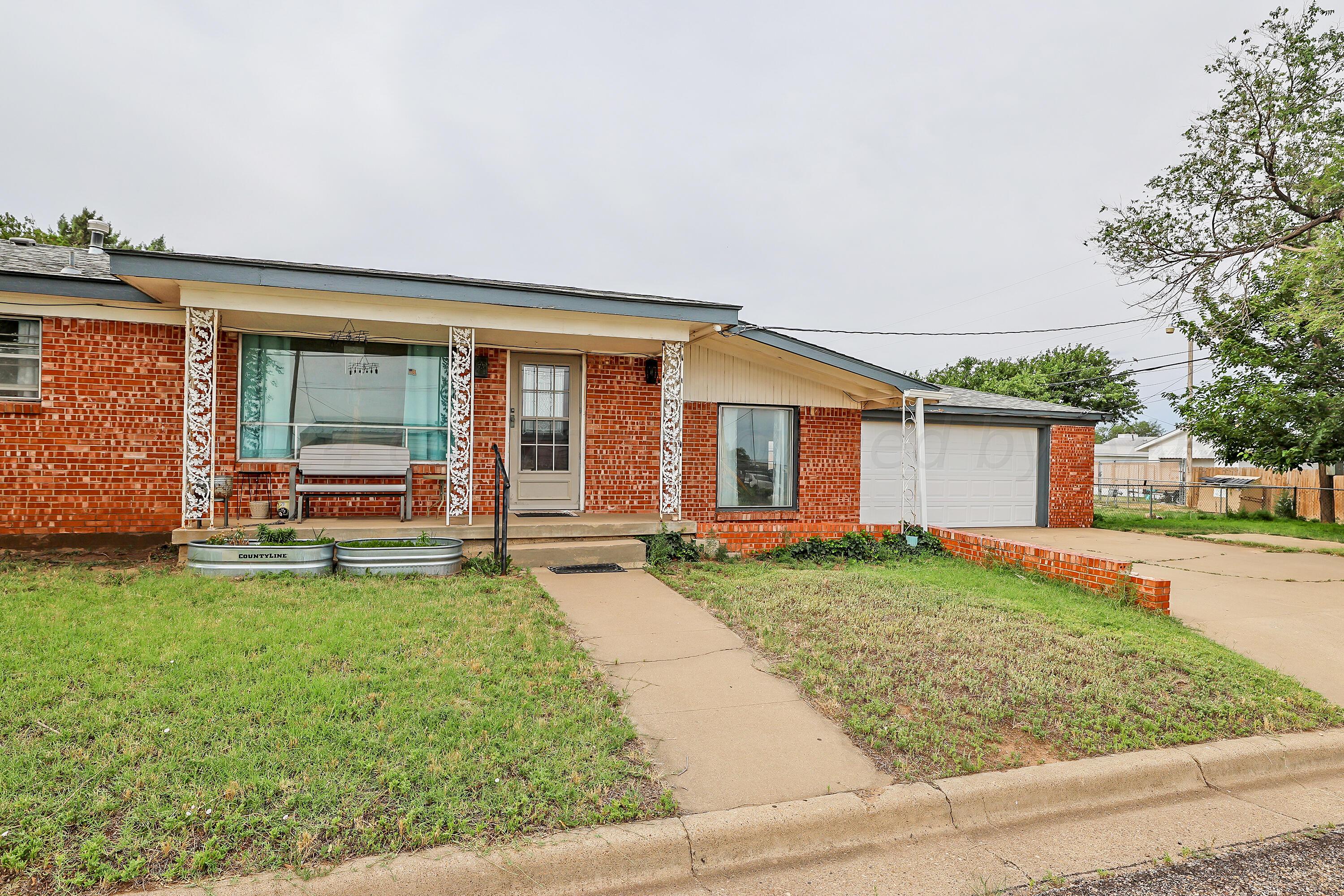 411 North Prospect Street Amarillo, TX 79106 - Photo 3 of 22 front view of a house with a yard