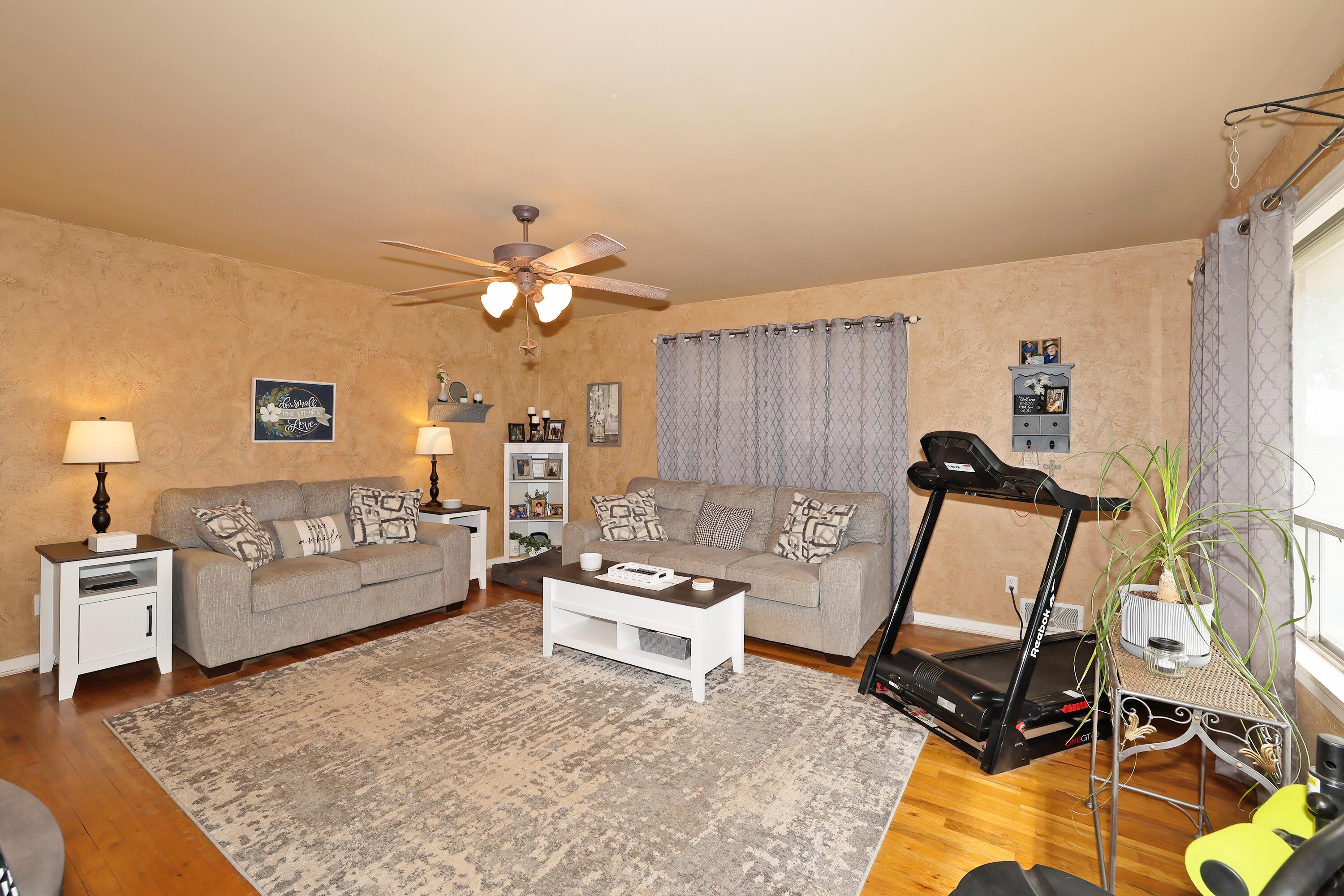 411 North Prospect Street Amarillo, TX 79106 - Photo 5 of 22 a living room with furniture and a chandelier