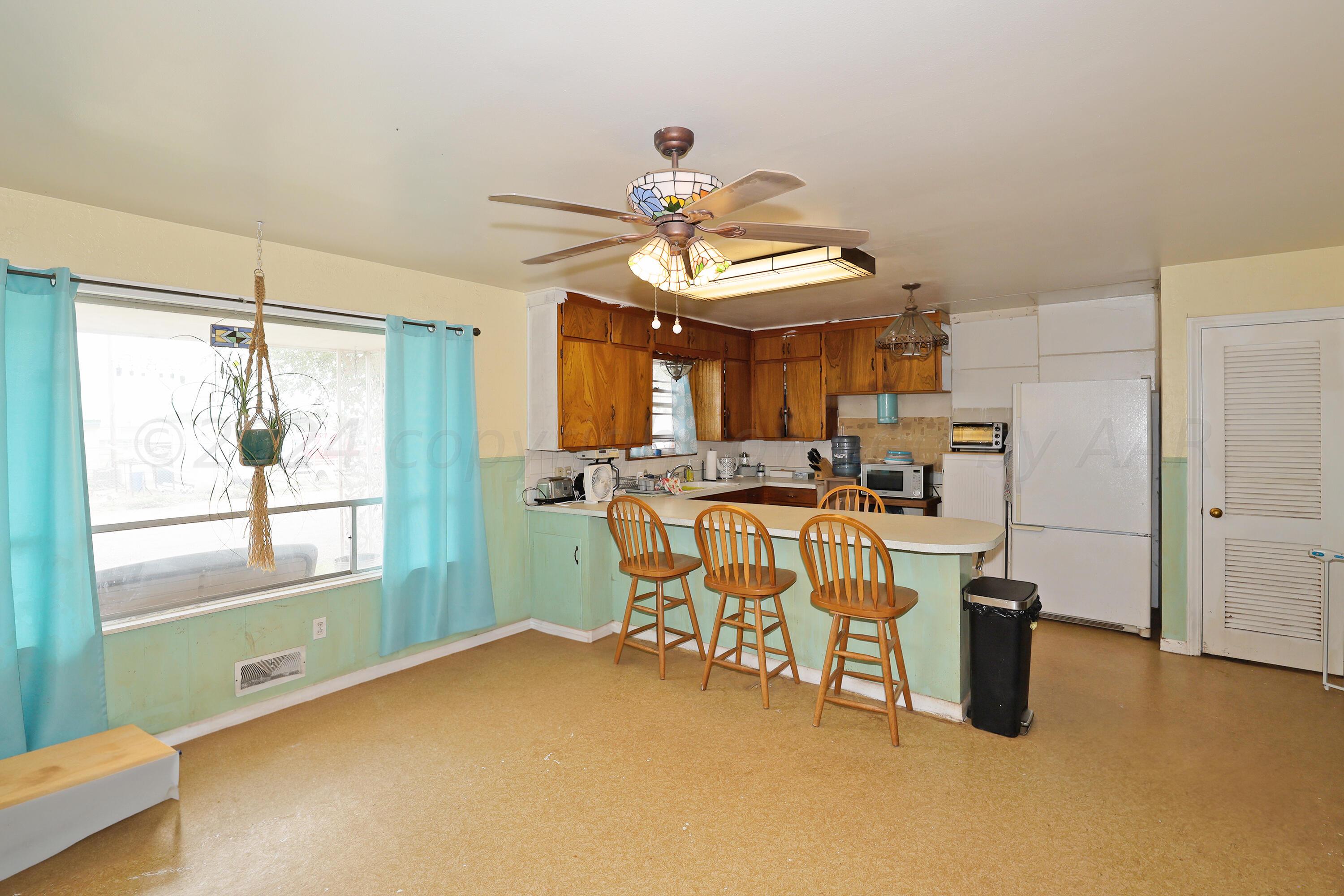 411 North Prospect Street Amarillo, TX 79106 - Photo 9 of 22 a dining room with furniture and a large window