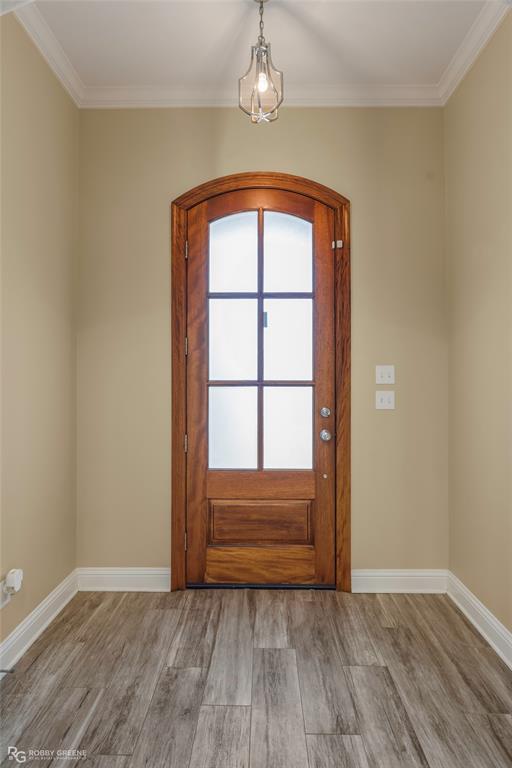 352 Wood Springs Haughton, LA 71037 - Photo 11 of 34 an empty room with wooden floor cabinet and window
