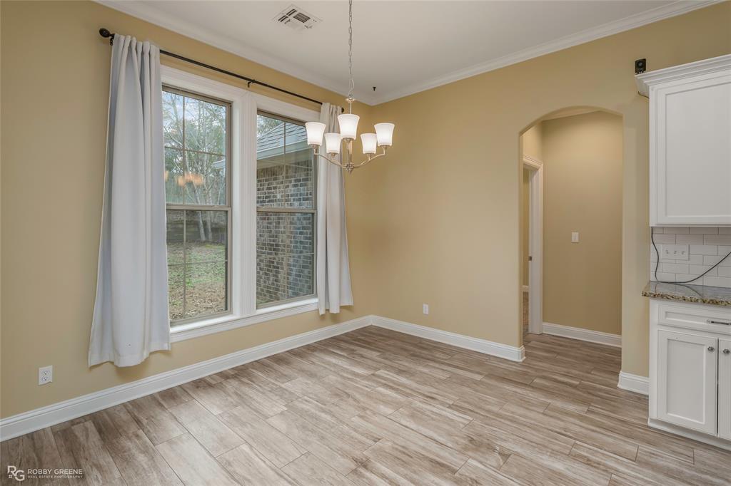 352 Wood Springs Haughton, LA 71037 - Photo 14 of 34 a view of livingroom with hardwood floor and window