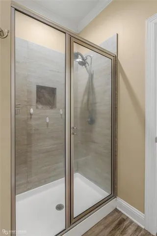 a bathroom with a glass shower door