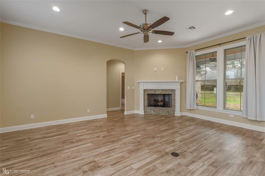 352 Wood Springs Haughton, LA 71037 - Photo 19 of 34 a view of an empty room with a window and fireplace
