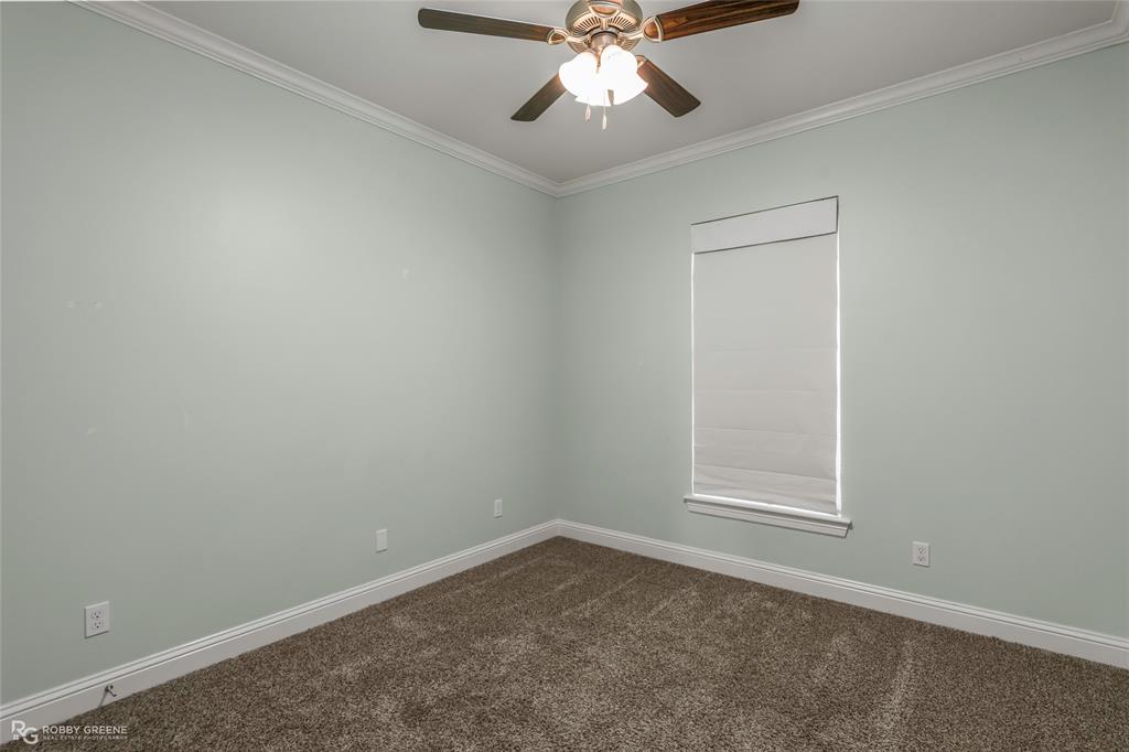 352 Wood Springs Haughton, LA 71037 - Photo 21 of 34 an empty room with a window and a fan