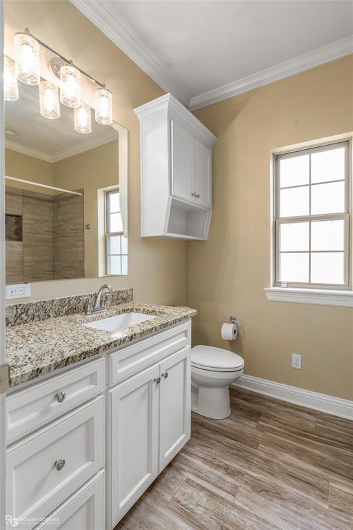352 Wood Springs Haughton, LA 71037 - Photo 22 of 34 a bathroom with a granite countertop toilet sink and mirror