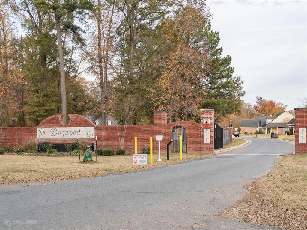 352 Wood Springs Haughton, LA 71037 - Photo 31 of 34 a sign board with a small yard plants and trees